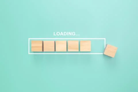 Showing loading bar with wood cube on pastel background. Progress bar made fr 写真素材