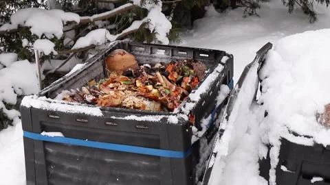 Showing open compost bin with bio waste inside. Video stock 262734178