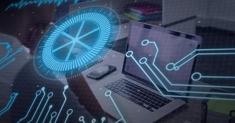 Showing open silver laptop with blue hologram circuit HUD at modern desk, with Stock Photos