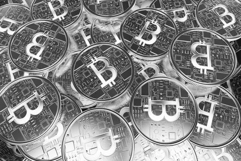 Showing overlapping Bitcoin coins featuring circuit board patterns in macro shot 스톡 사진
