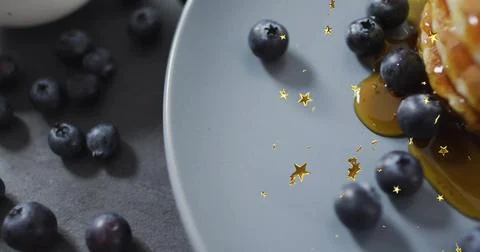 Showing pancake stack dripping maple syrup on grey plate at dark slate, Stock Photos