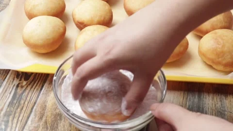 Showing the process of doughnuts coating in sugar Stock Footage 157393209