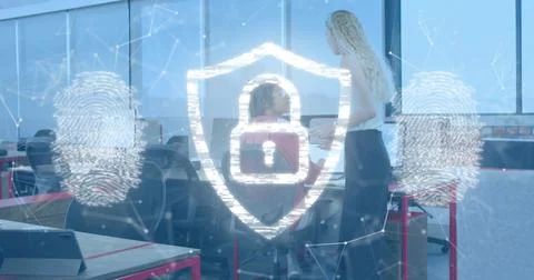 Showing security shield with padlock and fingerprint over office, colleagues in Stock Photos