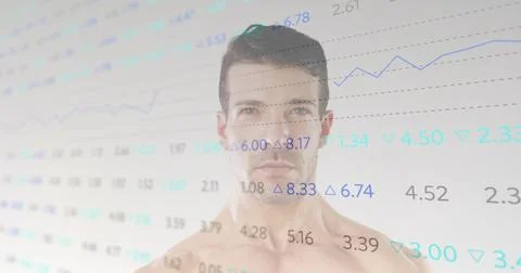 Showing shirtless man modeling in studio, displaying line charts with data fl Stock Photos