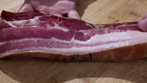 Showing a Slice of Pork Belly Vídeo Stock 348108472