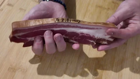 Showing a Slice of Pork Belly Vidéo 348108504