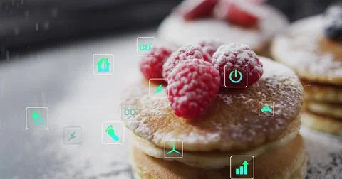 Showing small stack of pancakes topped with raspberries on dusted table, with Stock Photos