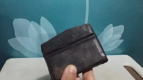 Showing a Solid Chocolate Bar on the Table and Its Cut Pieces Stock Footage 229303313