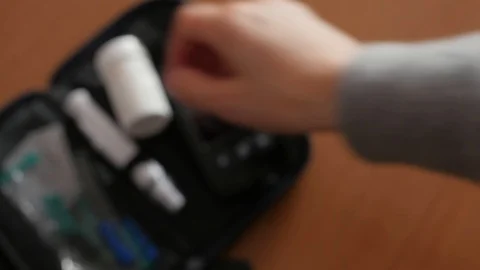 Showing strips for measuring level of glucose blood in glucometer Stock-Footage 102127074