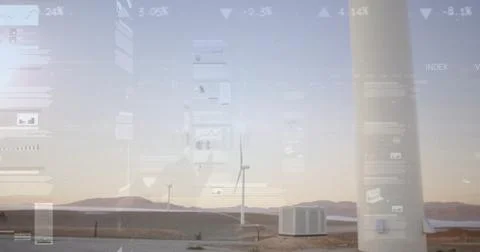 Showing turbine tower base with container displaying data overlays at wind farm Stockfoto's