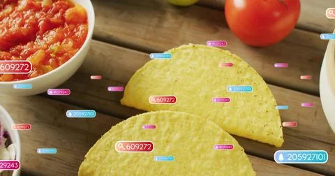 Showing two yellow corn shells overlapping on wood table, with salsa bowl slaw Stock Photos