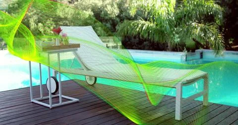 Showing white chaise sitting at backyard pool on wood deck, with side-table tray Stock Photos