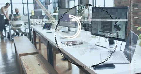 Showing white desk centered in tech office with monitors and HUD, coworkers left Stock Photos
