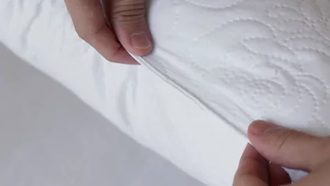 Showing the white pillow Stock Footage 156069643
