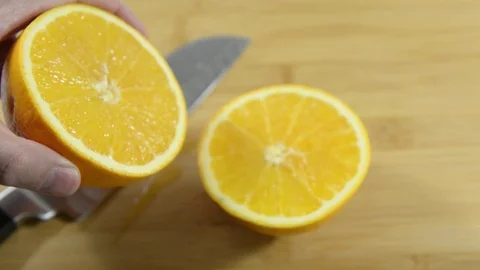 Shows half a juicy orange on the table. Stock-Footage 124084070