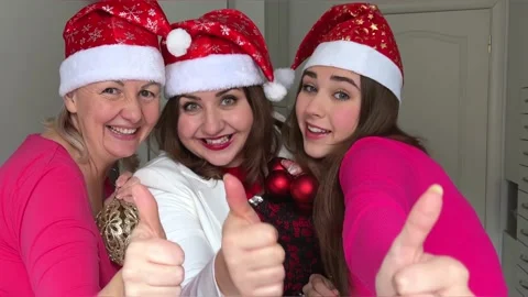 Shows the thumb in the frame shows the class Three women are celebrating the New Stock Footage 222851328