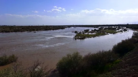 A shows a wide river meandering through a green landscape, stock footage. Stock Footage 304784582