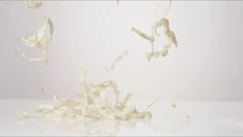 Shredded Cabbage Bouncing Slow Motion White Tabletop Closeup Macro Food Studio Stock Footage 335006329