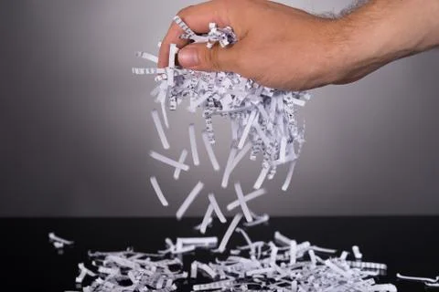 Shredded documents in security concept over black background Stock Photos