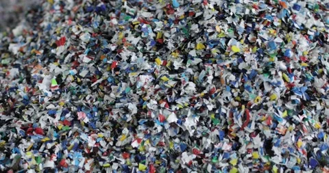 Shredded multi-colored plastic. Close-up. Waste recycling stage. Stock Footage 168047700