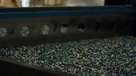 Shredded Plastic Granulate On Vibrating Conveyor, Recycling Plant, Close Up Shot Stock Footage 341335199