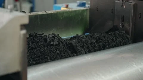 Shredded Rubber Being Processed Inside Industrial Recycling Machine Stock Footage 322219850
