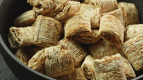 Shredded wheat cereal mini macro close up presentation slowly rotating stoc.. Stock Footage 344685693