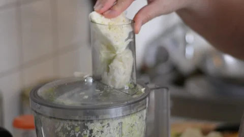 Shredding cabbage in a food processor Stock Footage 111724543