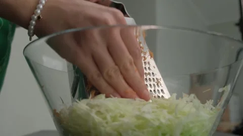 Shredding Cabbage with Grater in Cooking Kitchen Close-up Stock-Footage 341421211