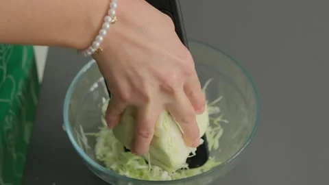 Shredding Cabbage with Grater in Cooking Kitchen Stock-Footage 341449857