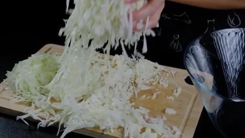 Shredding Cabbage in a Kitchen at Cooking Stock-Footage 341428712