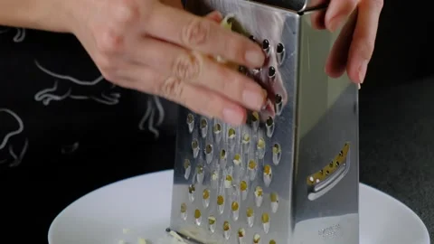 Shredding Cheese on Box Grater in Cooking Kitchen Stock Footage 341429370