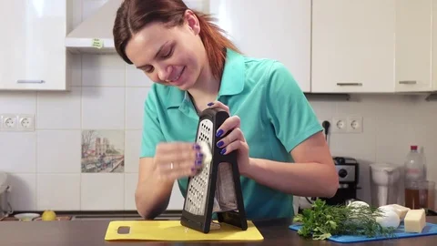 Shredding cheese on grater Stock Footage 74055048
