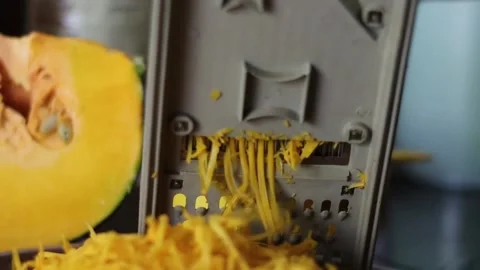 Shredding of pumpkin in to thin strings Stock Footage 237181921