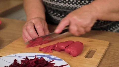 Shredding red pepper into thin strips for Ukrainian borscht. Cutting sweet pod Stock Footage 333241572