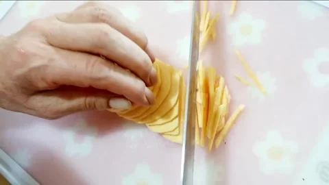 Shredding sweet potatoes Stock Footage 204838592