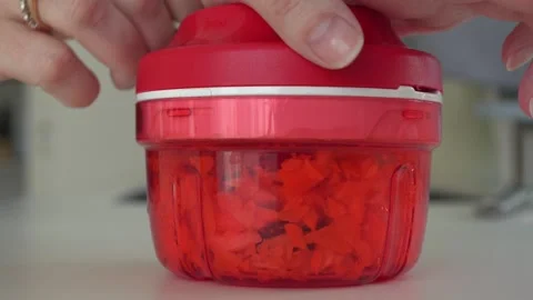 Shredding Vegetables by Pulling a String in Handheld Grater Video stock 306577981