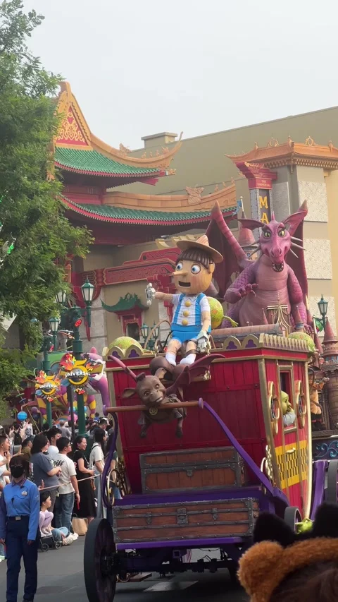 Shrek characters on decorative float during amusement theme park Stock Footage 338446945