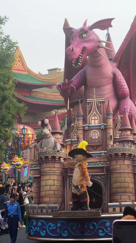 Shrek characters on decorative float during amusement theme park Stock Footage 338447010