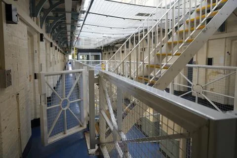 Shrewsbury Prison Cell Block Interior With Stairs, Railings, And Safety Netting. Stock Photos