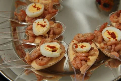 Shrimp amuse appetizer on spoon Stock Photos