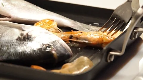 Shrimp and dorada fried in a pan Stock Footage