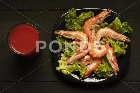 Shrimp and tomato juice on the table Stock Photos
