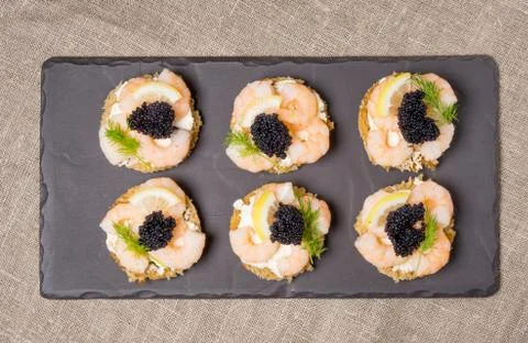 Shrimp Appetizer served on toasted bread Stock Photos