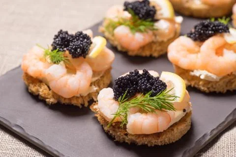 Shrimp Appetizer served on toasted bread Stock Photos