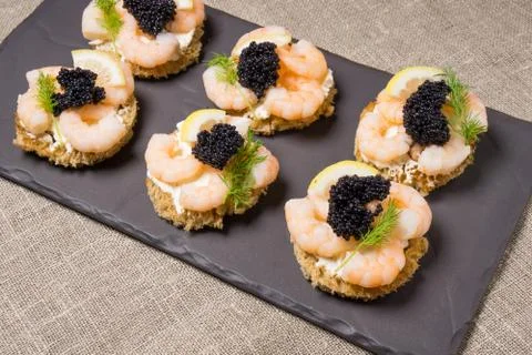 Shrimp Appetizer served on toasted bread Stock Photos