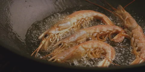 Shrimp are cooked in a saucepan Stock Footage 247379747