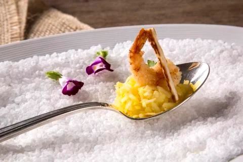Shrimp breaded in tapioca with coconut rice and crispy coal cheese Stock Photos