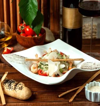 Shrimp caesar salad and crispy sticks Stock Photos