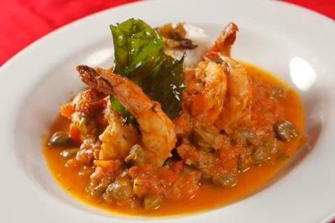 Shrimp with caper, chaya leaf and steamed rice. Stock Photos
